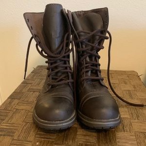Dark brown boots. Worn once. Zipper on inside and tie in front